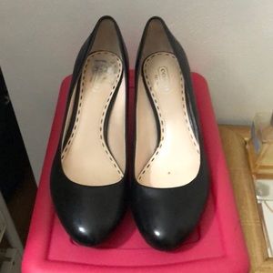 Black leather Coach pumps